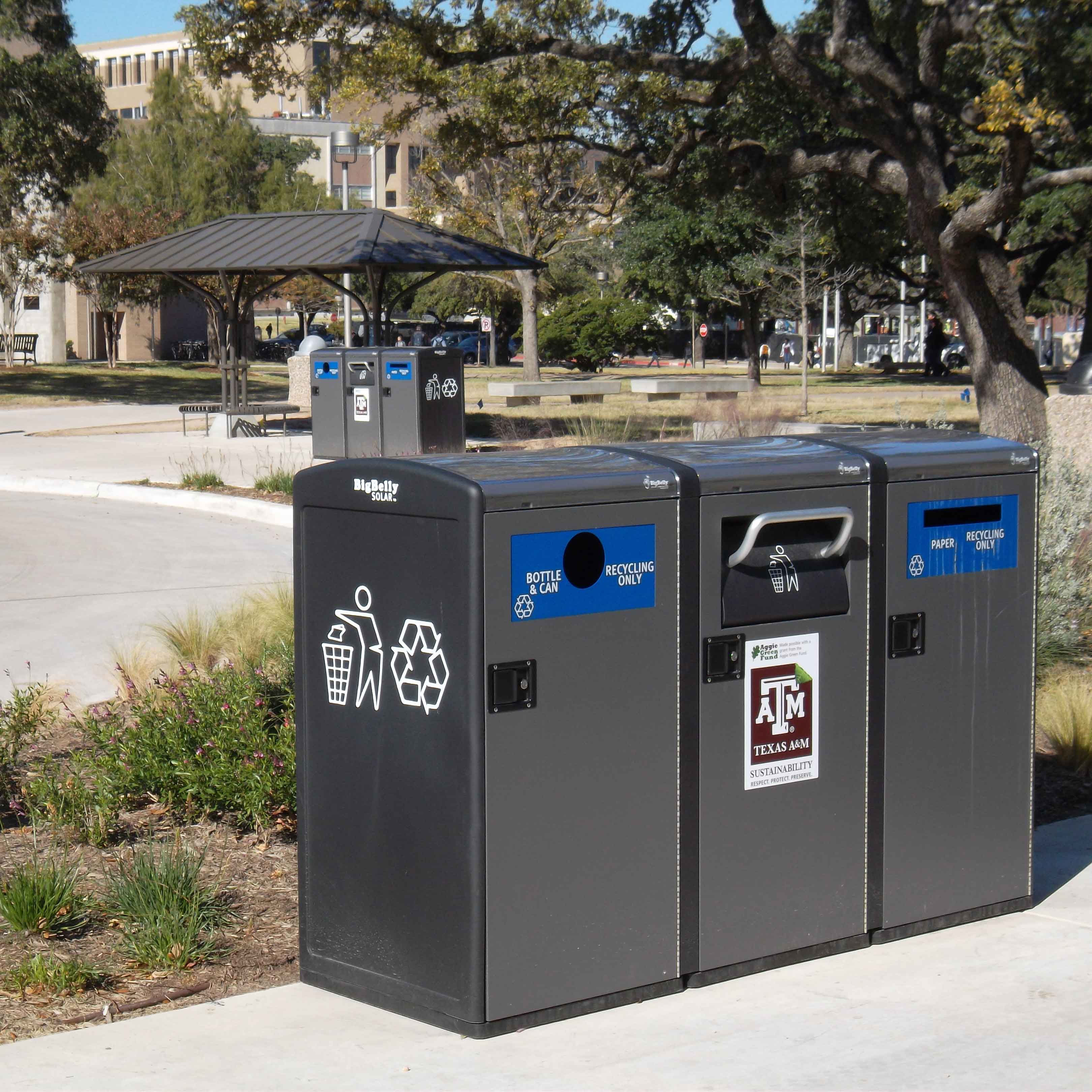 Set of three exterior recycling bins on campus