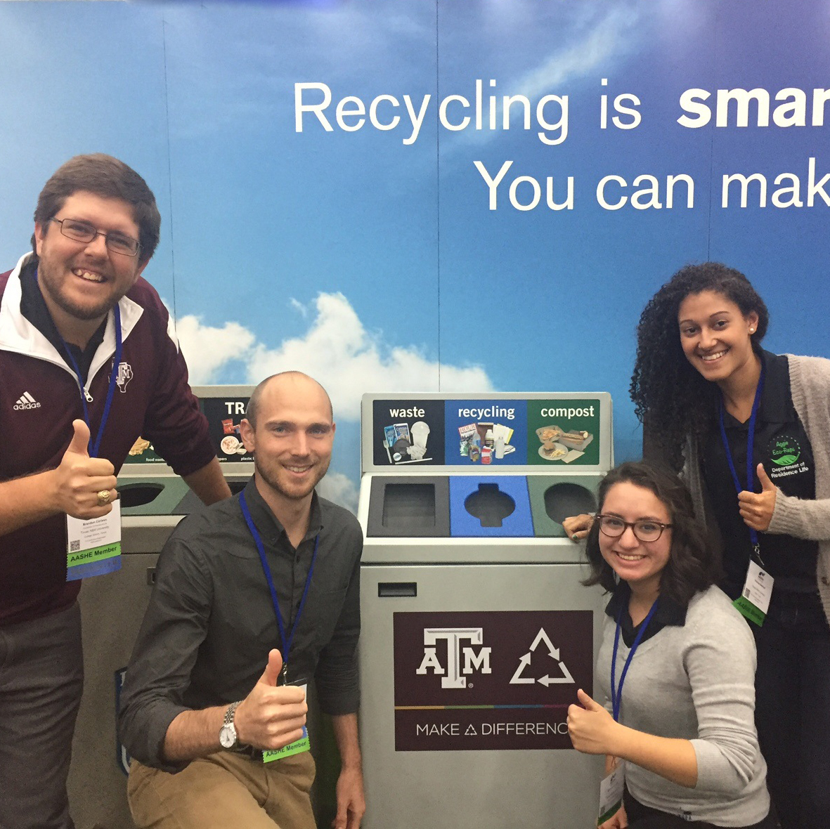 Students with Stainless Steel recycling containers